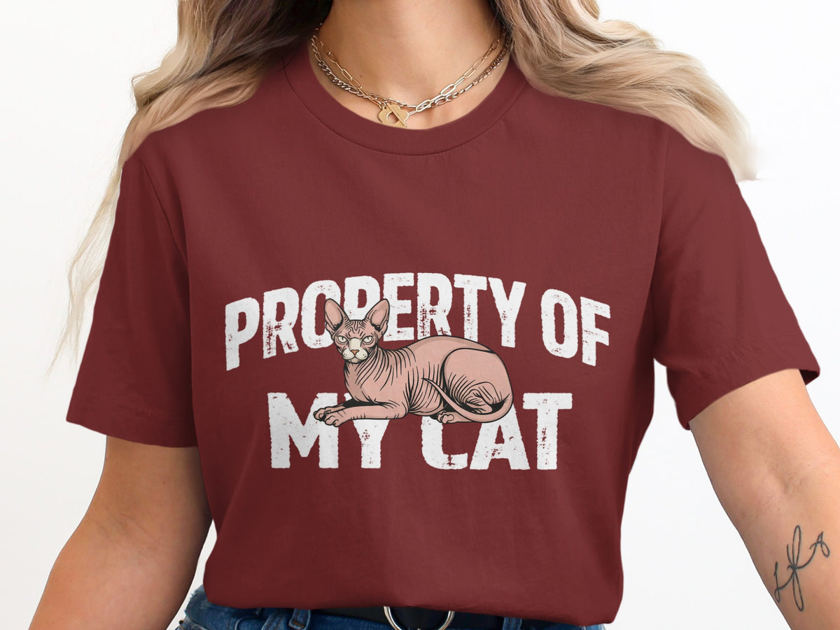 Maroon t-shirt with "Property of My Cat" text and Sphynx cat graphic.