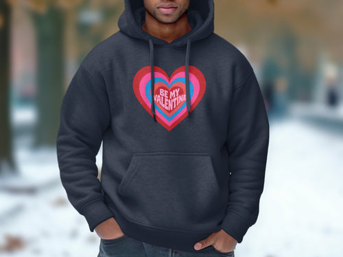 Dark grey hoodie with a concentric heart design and "BE MY VALENTINE" text.