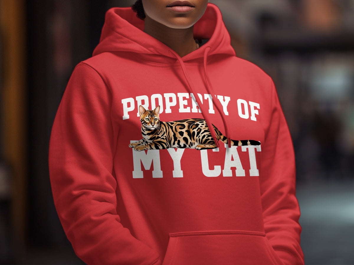 Red hoodie with white text "PROPERTY OF MY CAT" and a Bengal cat graphic.