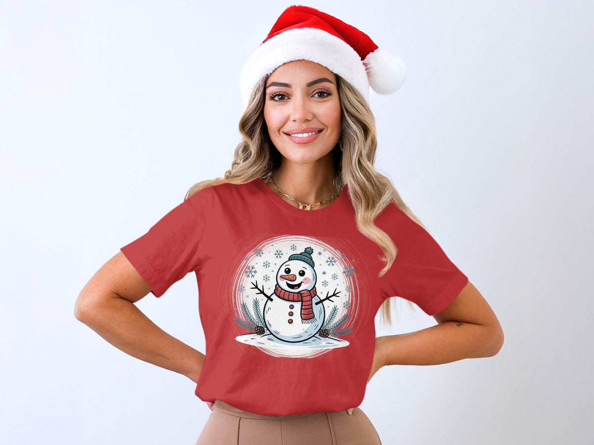 Red t-shirt with cheerful cartoon snowman and snowflakes graphic.