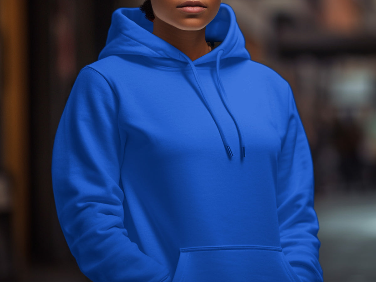 Front view of a person wearing a royal blue hooded sweatshirt with pockets.
