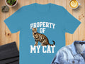 Blue t-shirt with text "PROPERTY OF MY CAT" and a Bengal cat graphic.
