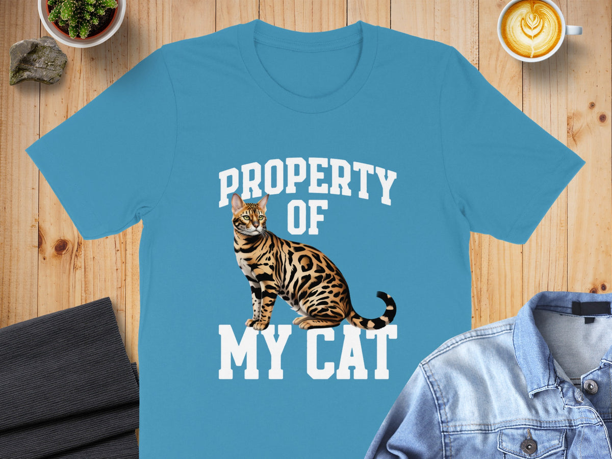 Blue t-shirt with text "PROPERTY OF MY CAT" and a Bengal cat graphic.