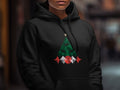Black hoodie with geometric Christmas tree graphic and star.