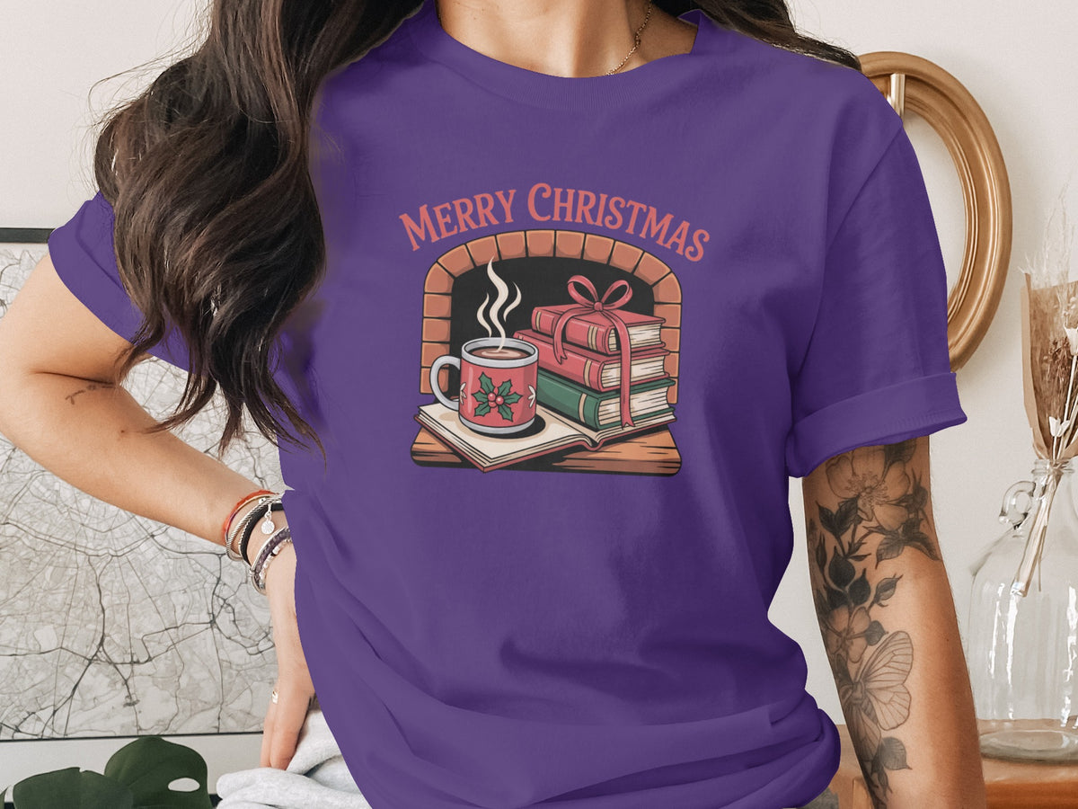 Purple t-shirt with "Merry Christmas" over fireplace, books, and hot cocoa.