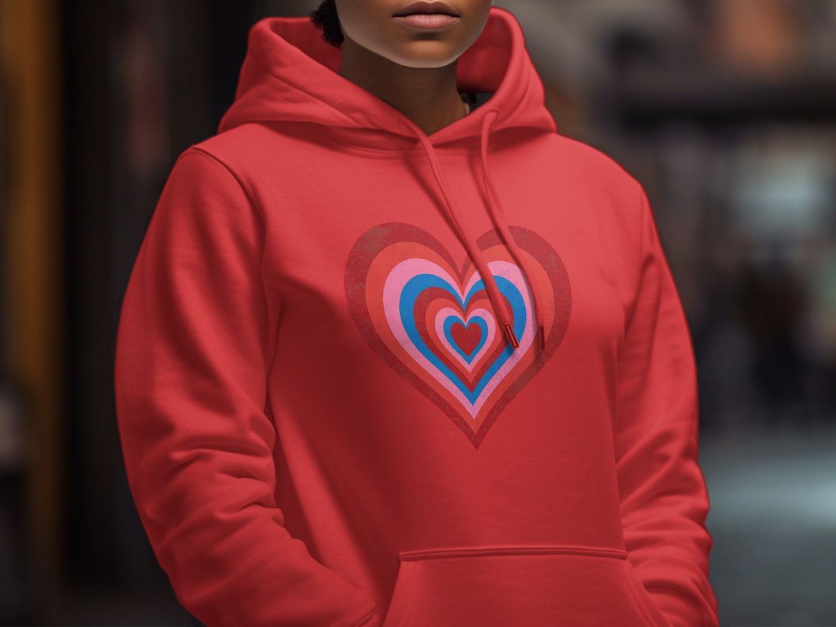 Red hoodie with a layered heart graphic in pink, blue, and red.