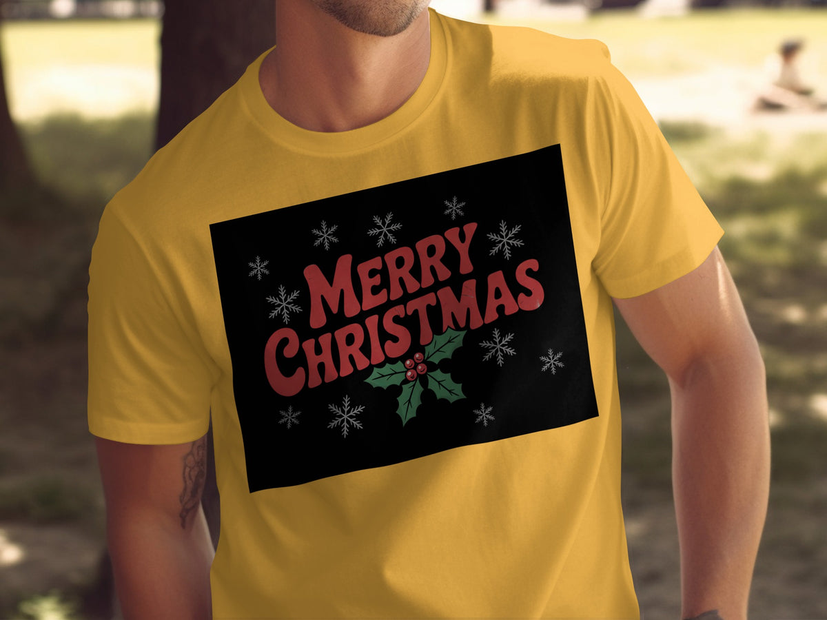 Yellow t-shirt with black graphic saying "Merry Christmas" and holly.