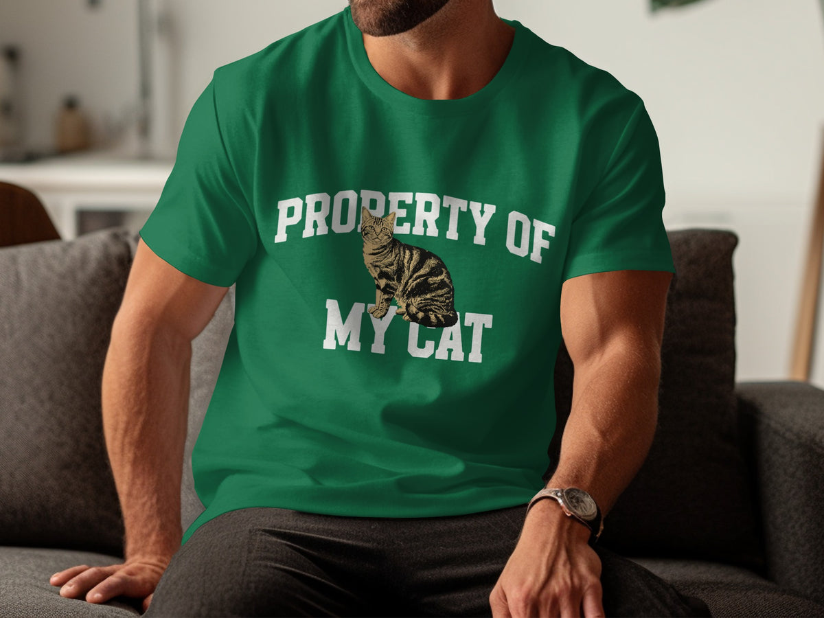 Green t-shirt with white text "PROPERTY OF MY CAT" and a cat graphic.