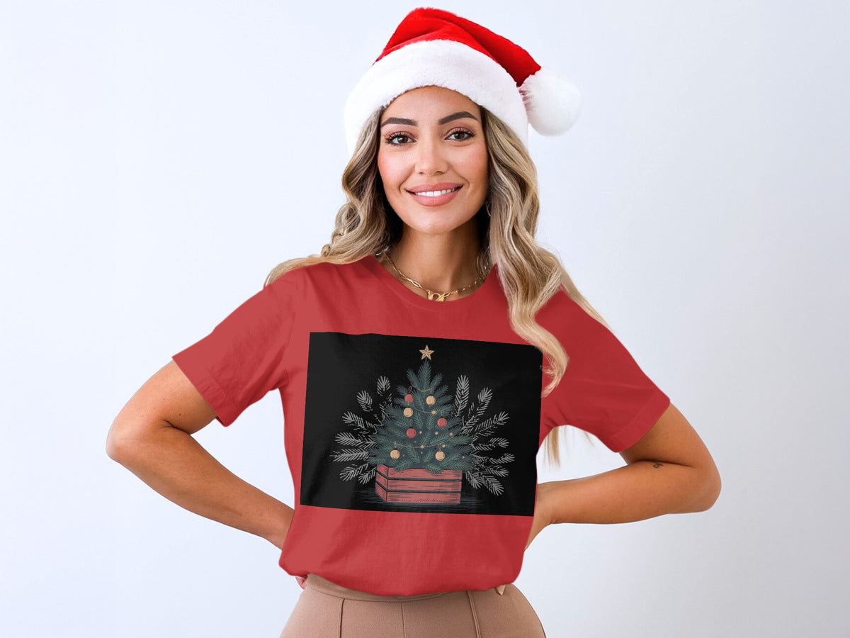 Red t-shirt with Christmas tree illustration and Santa hat on woman.