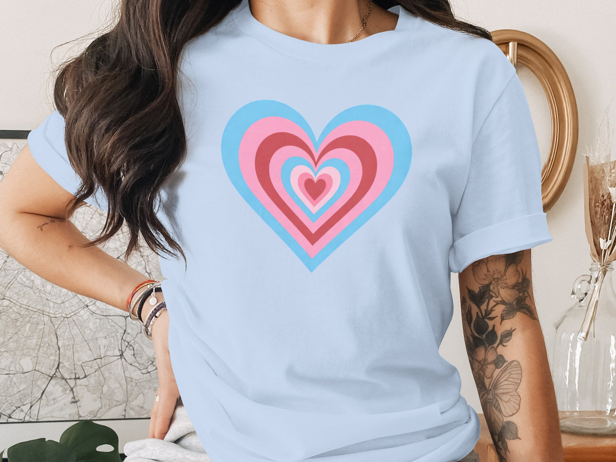 Light blue t-shirt with nested pink and blue hearts graphic.