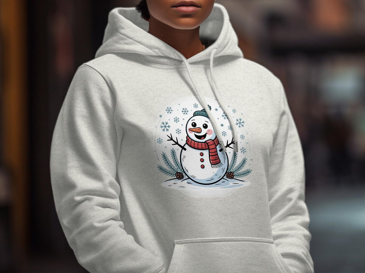 A person wearing a light gray hooded sweatshirt with a cartoon snowman graphic on the chest.