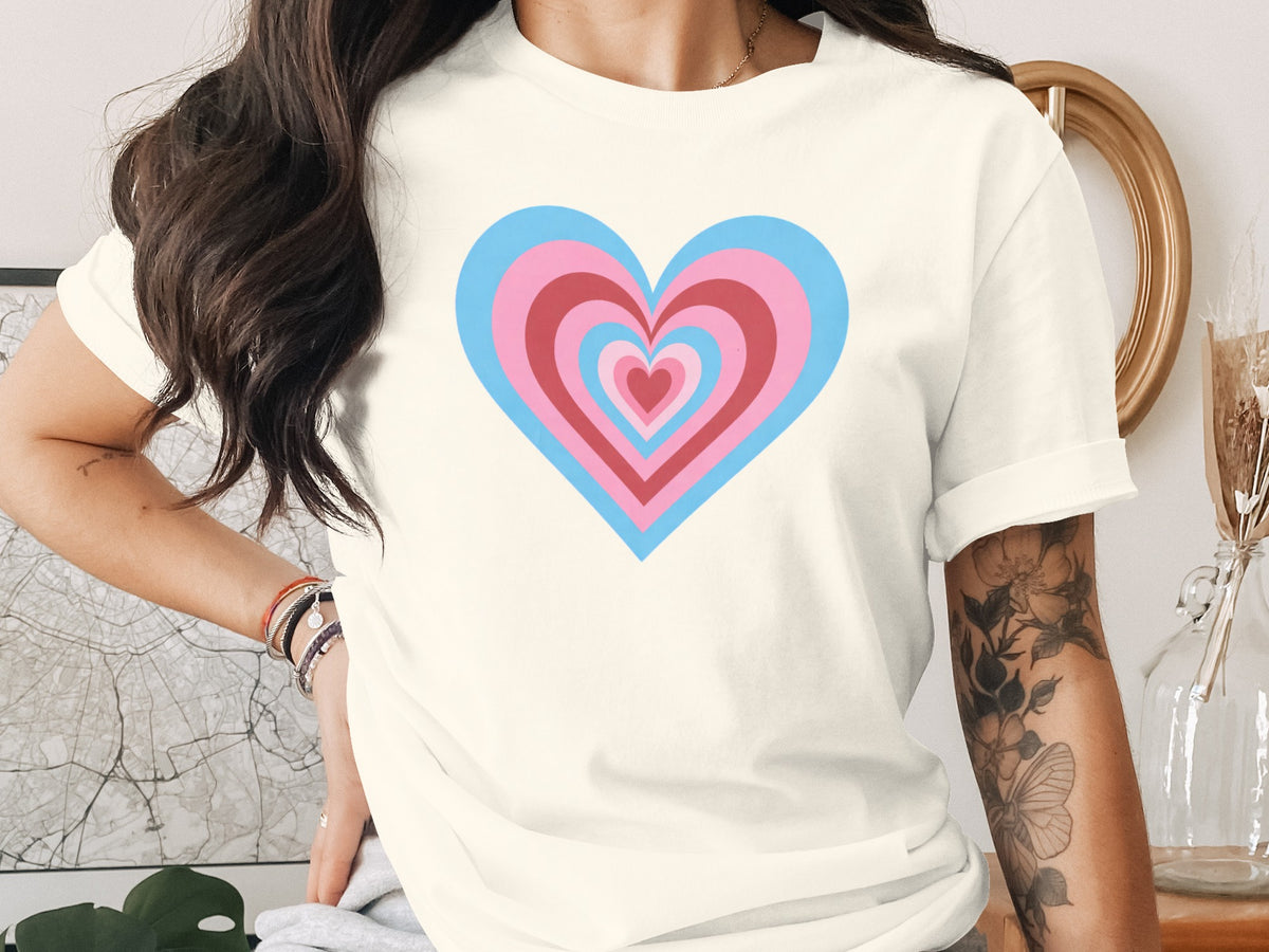 Cream t-shirt with concentric hearts in pink, blue, and red.