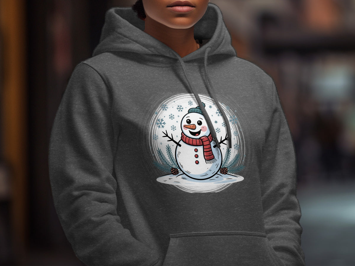 A person wearing a dark gray hoodie featuring a graphic of a smiling snowman with a red scarf.
