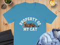Blue t-shirt with "PROPERTY OF MY CAT" text and a Bengal cat graphic.