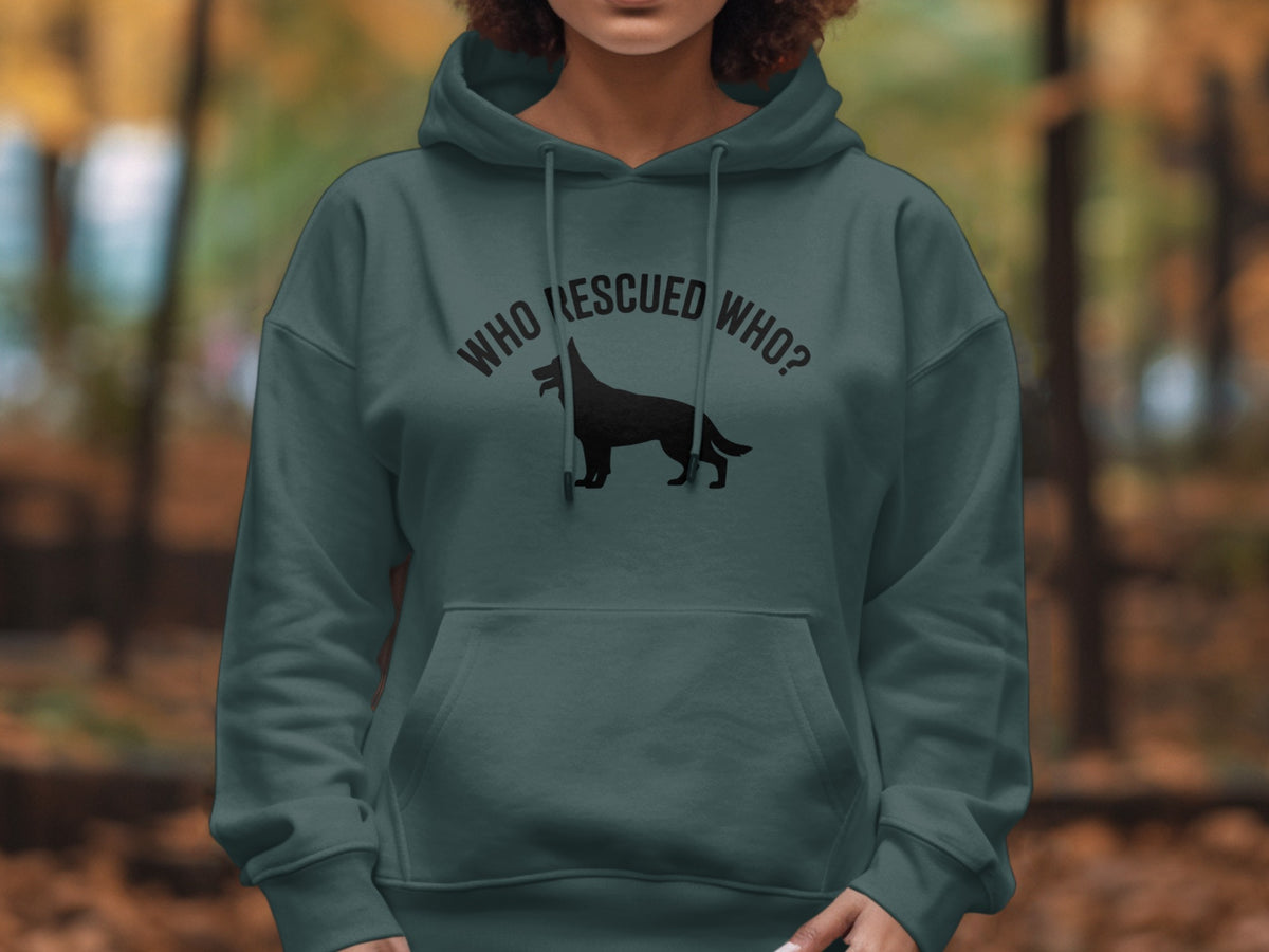 Dark teal hoodie with black text "WHO RESCUED WHO?" and dog silhouette.