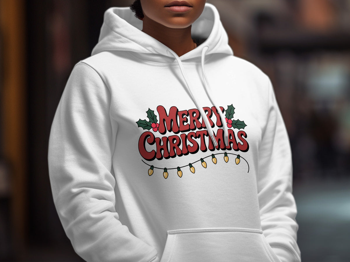 A person wearing a white hooded sweatshirt with a red Merry Christmas graphic and string lights.