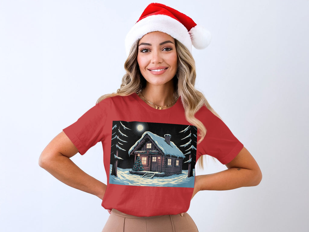 Red t-shirt with a snowy cabin and Christmas tree graphic.