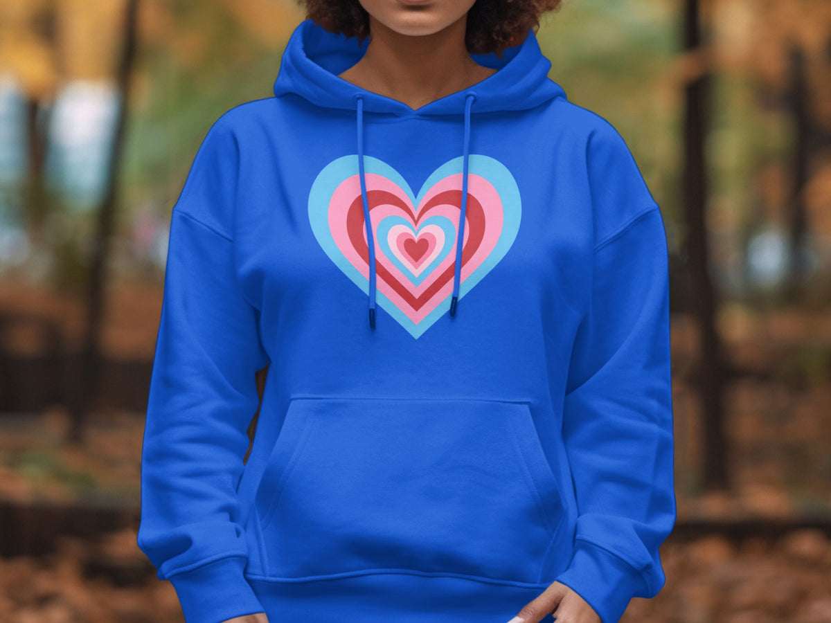 Blue hoodie with a pink, blue, and red layered heart graphic on chest.