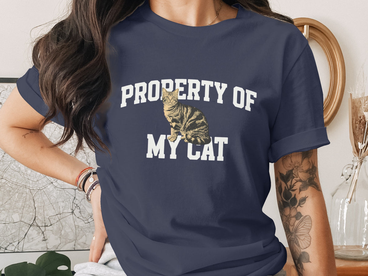 Navy t-shirt with "PROPERTY OF MY CAT" text and a tabby cat graphic.