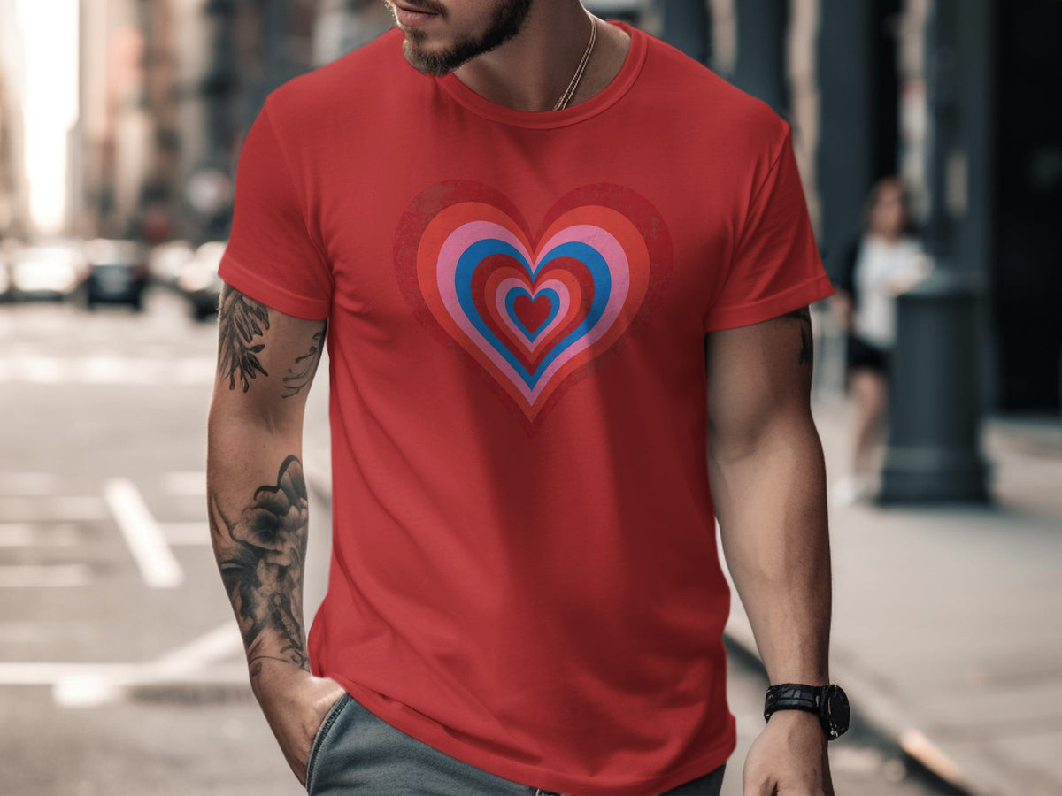 Red t-shirt with concentric pink, blue, and red heart graphic.