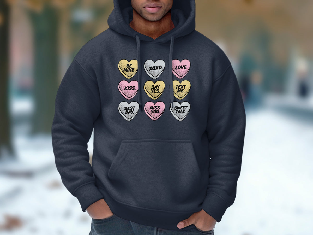 Dark gray hoodie with nine candy hearts featuring Valentine's Day phrases.