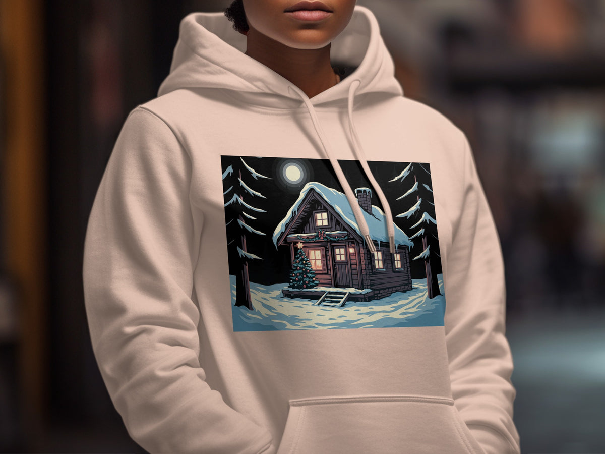 A person wearing an off-white hoodie featuring a graphic of a snow-covered cabin at night.
