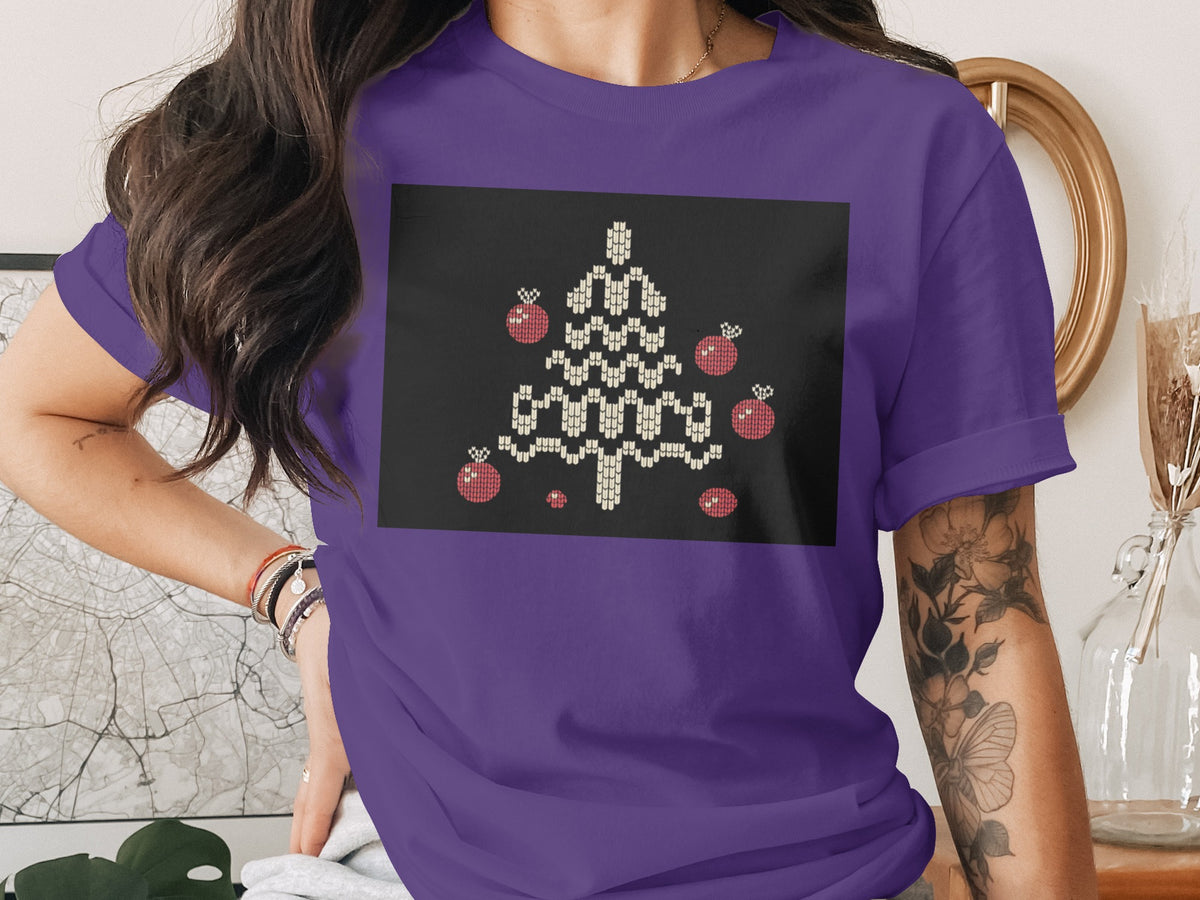 Purple t-shirt with a black square featuring a knit-style Christmas tree and ornaments.
