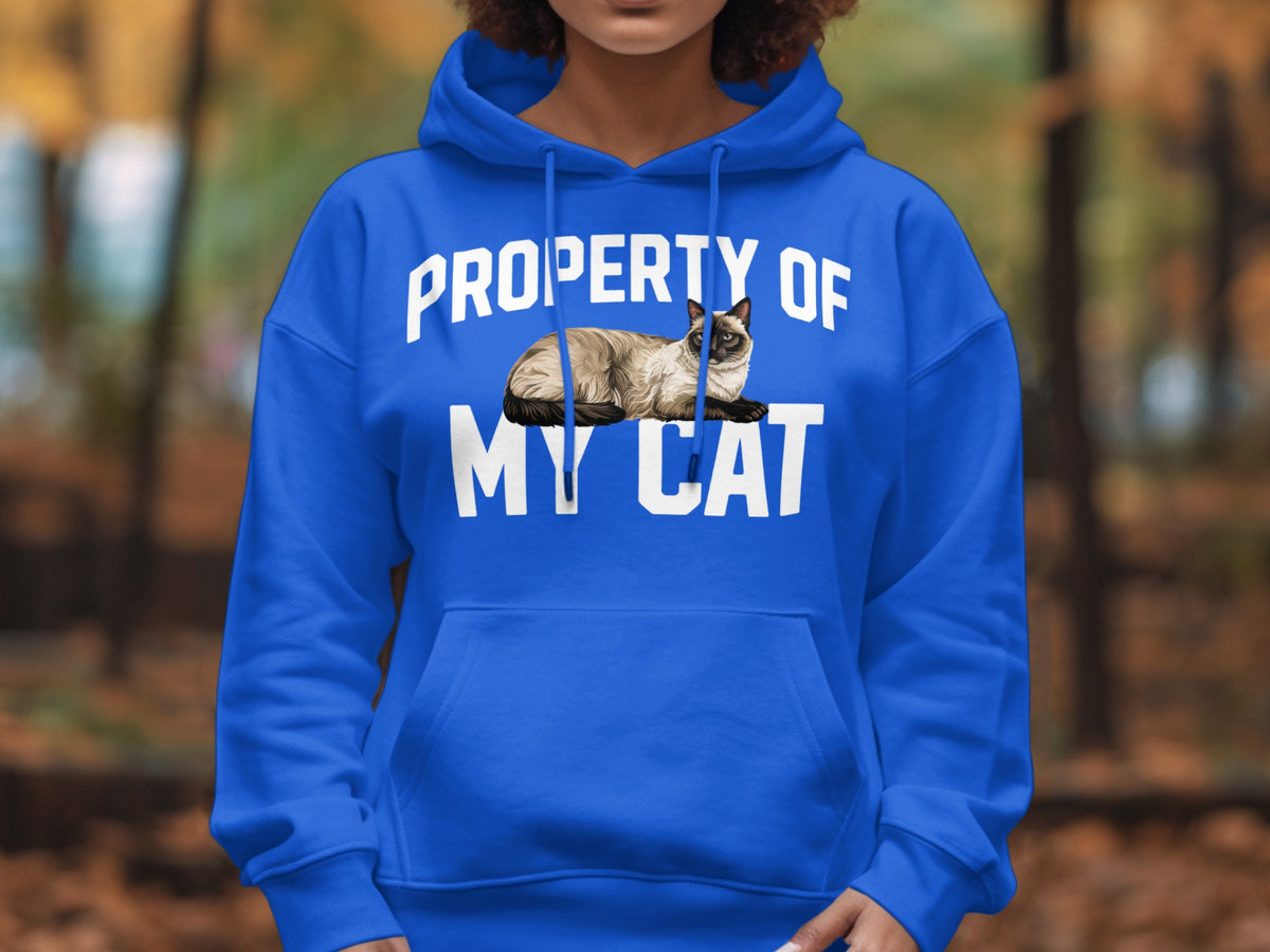 Blue hoodie with "Property of My Cat" text and a Siamese cat illustration.