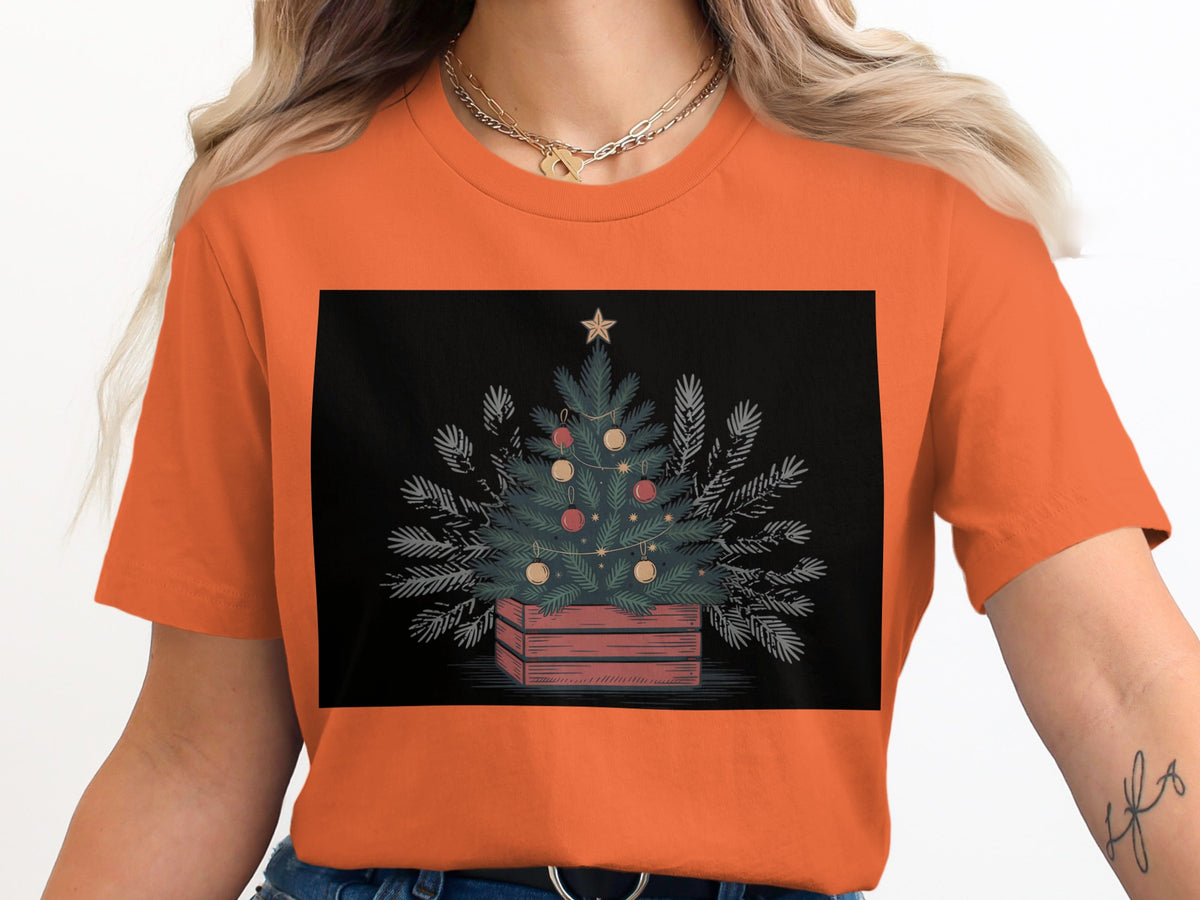 Decorated Christmas tree in a wooden crate with star on black background.