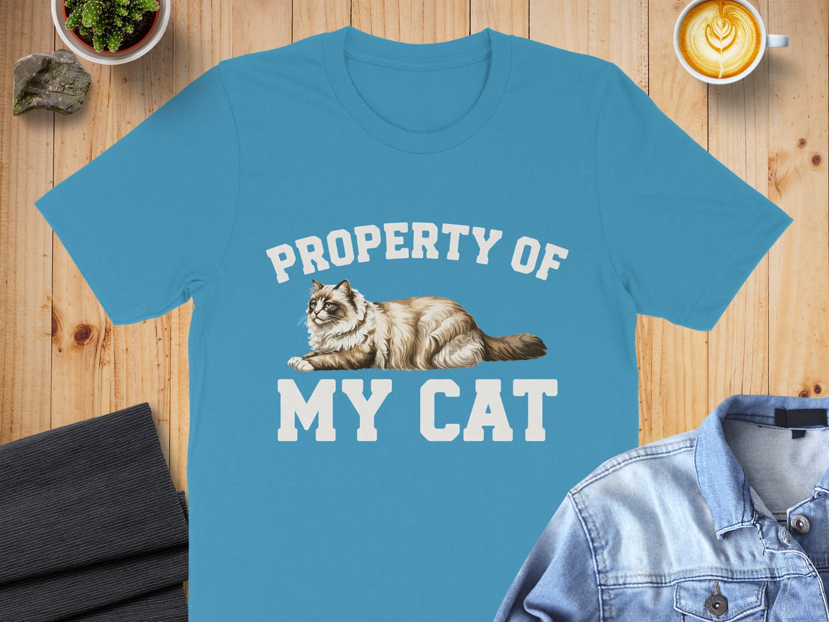 Blue t-shirt with "PROPERTY OF MY CAT" and a drawing of a cat.