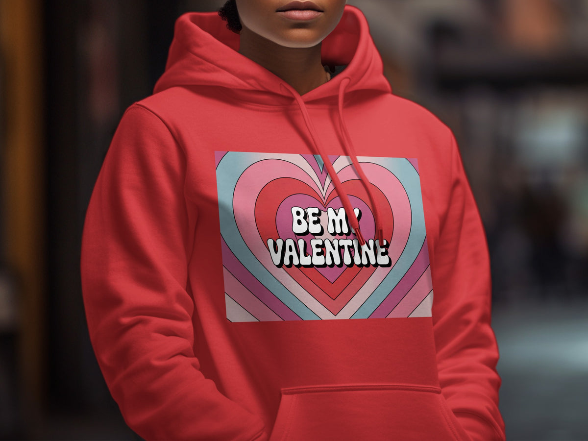 Red hoodie with "BE MY VALENTINE" text on a pastel heart graphic.