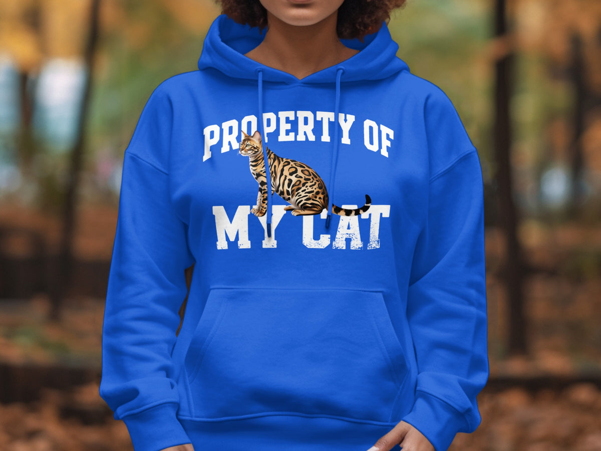 Royal blue hoodie with "Property of my cat" text and a Bengal cat graphic.