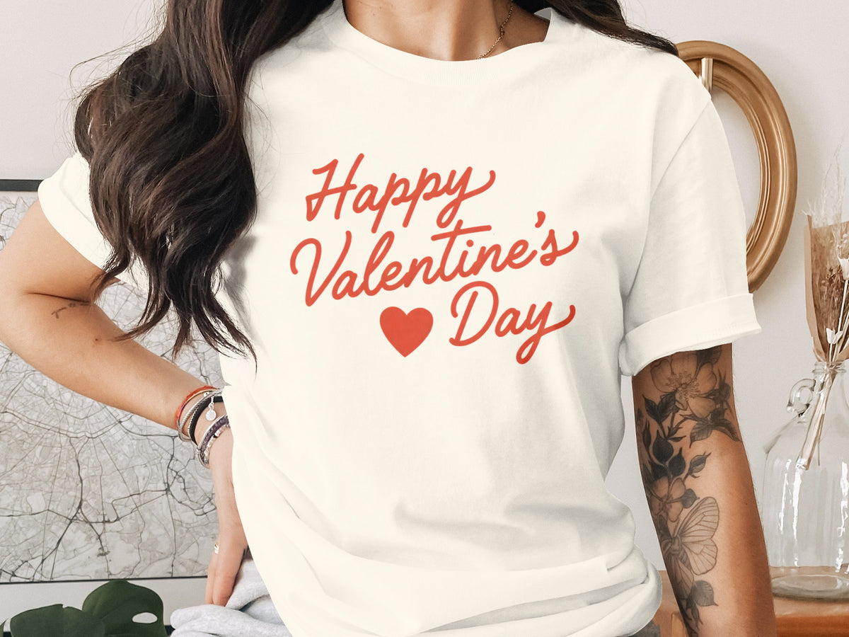 Cream t-shirt with red "Happy Valentine's Day" text and heart graphic.