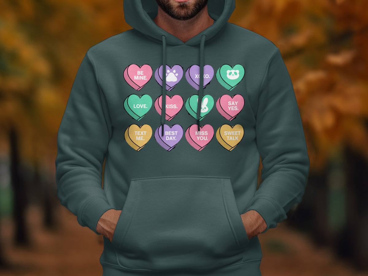 Hoodie with conversation hearts that say "Be Mine," "Love," "Text Me," "XOXO," "Kiss," "Best Day," "Say Yes," "Miss You," and "Sweet Talk."