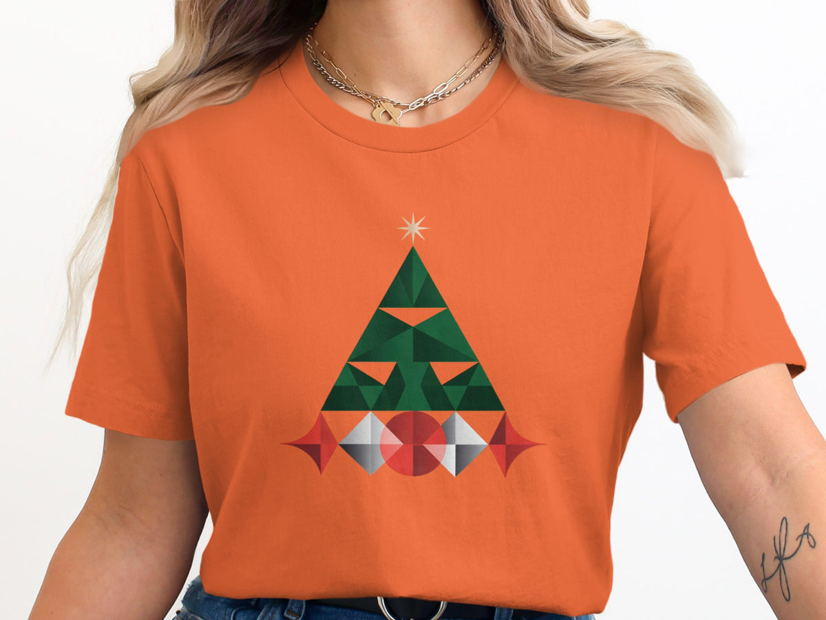 Orange t-shirt with a geometric green Christmas tree and star graphic.