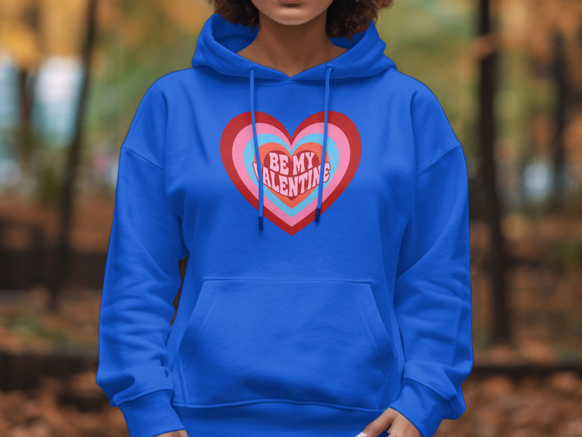 Blue hoodie with concentric hearts graphic that reads "Be My Valentine".
