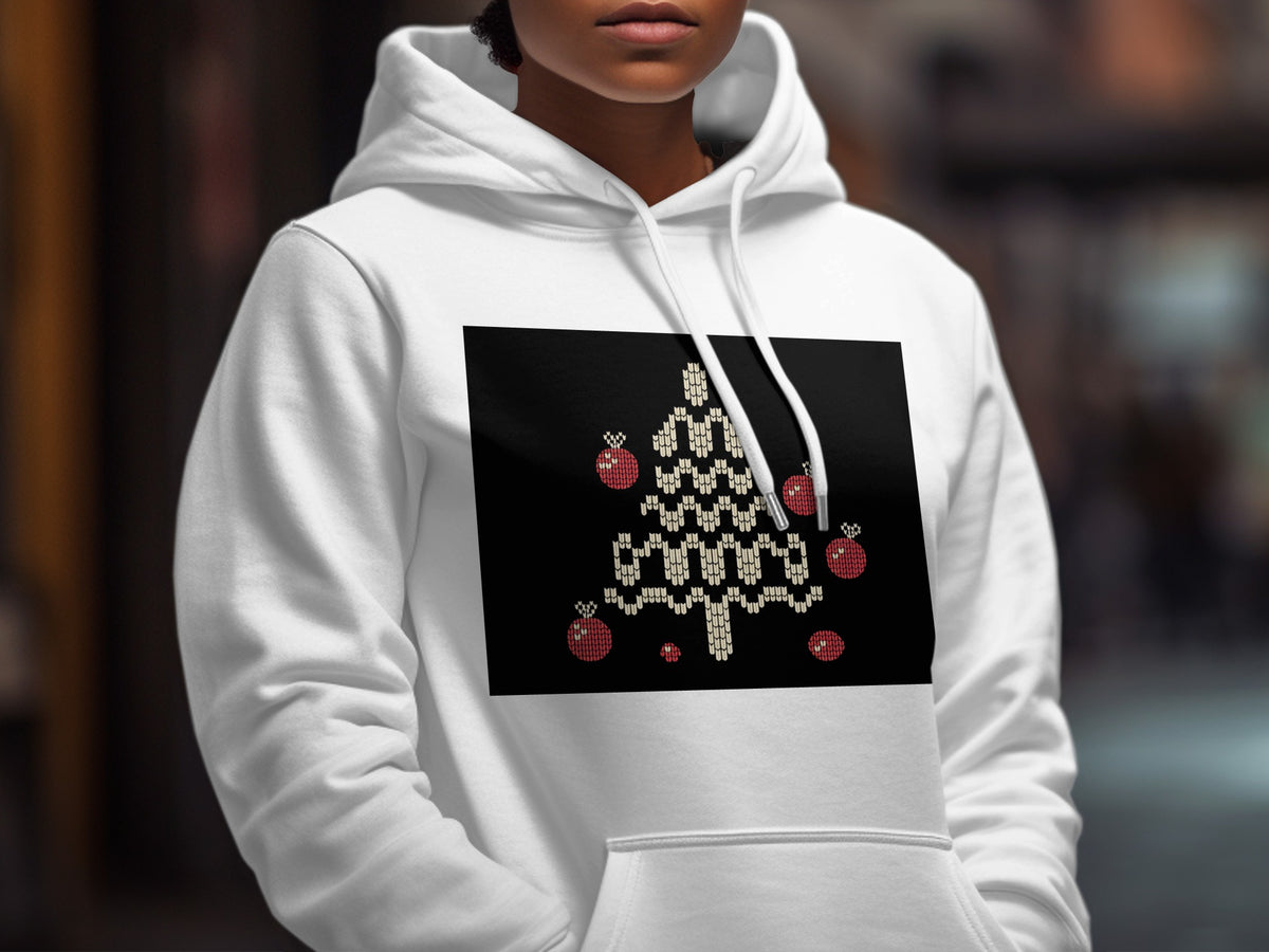 A person wearing a white hooded sweatshirt with a knit-style Christmas tree graphic on the chest.