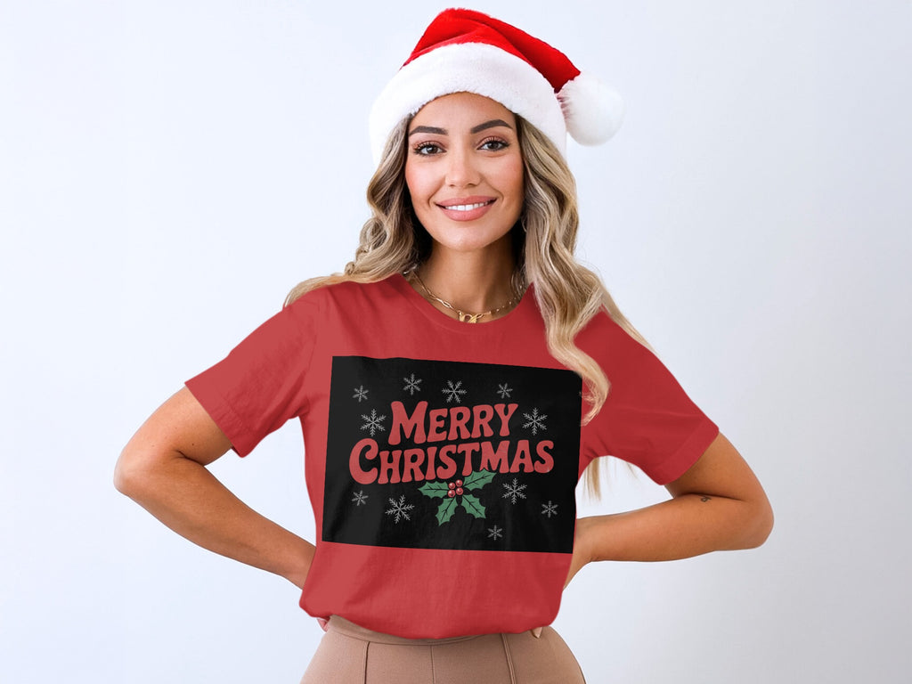 Red t-shirt with "Merry Christmas" text, holly, and snowflakes design.