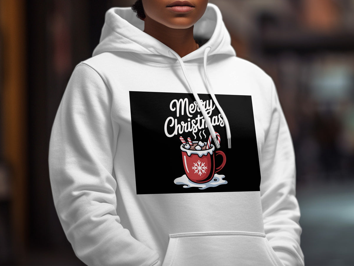 A person wearing a white hooded sweatshirt with a Merry Christmas hot cocoa graphic on the chest.