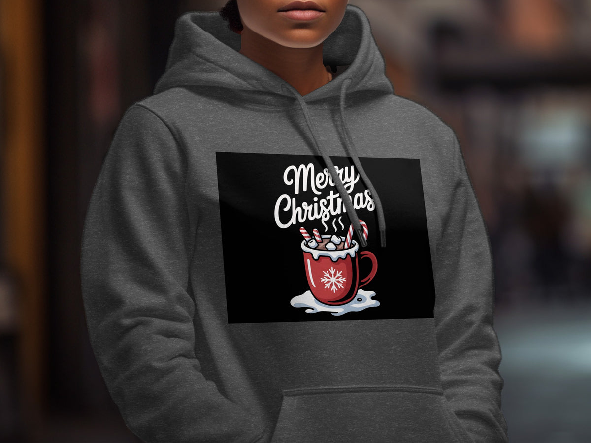 A person wearing a gray hooded sweatshirt with a Merry Christmas graphic of a cocoa mug.