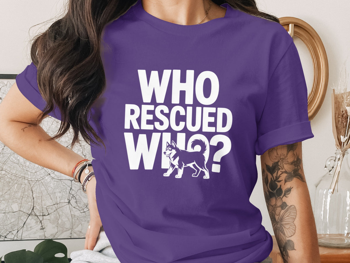 Purple t-shirt with white text "Who Rescued Who?" and a husky illustration.