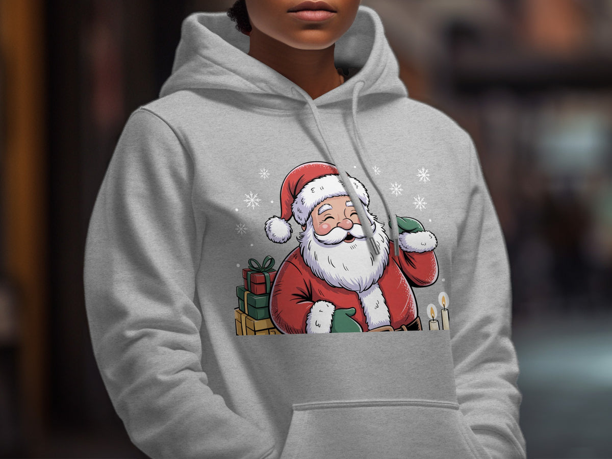 A person wearing a light gray hoodie printed with a cartoon Santa Claus graphic surrounded by presents and snowflakes.