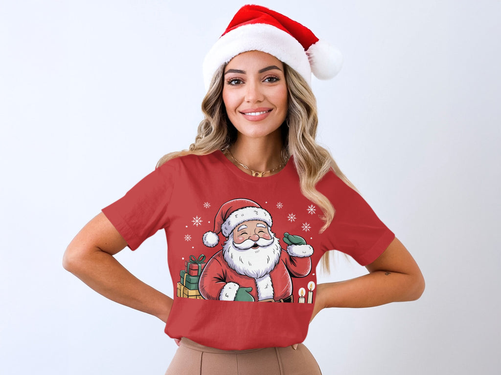 Red t-shirt featuring a smiling cartoon Santa Claus graphic with gifts and candles.