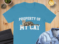 Blue t-shirt with "PROPERTY OF MY CAT" and a tabby cat illustration.