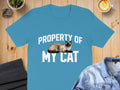 Blue t-shirt with "Property Of My Cat" and a Siamese cat illustration.