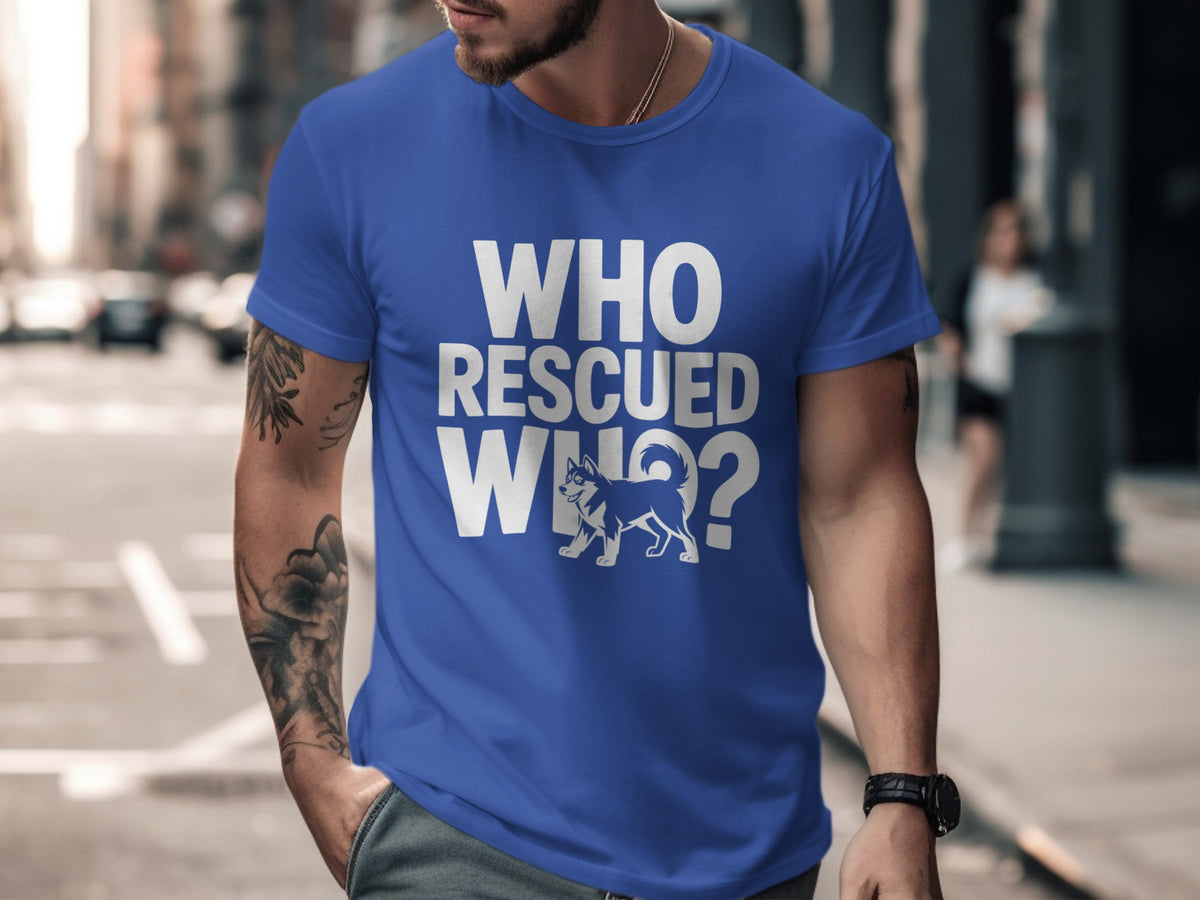 Blue t-shirt with white text "WHO RESCUED WHO?" and a dog graphic.