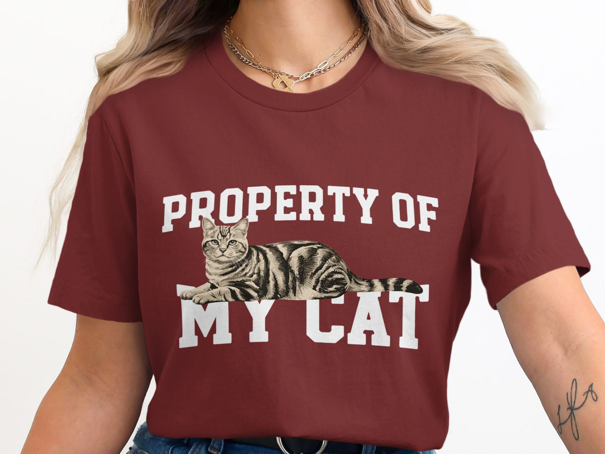 Maroon t-shirt with white text "PROPERTY OF MY CAT" and a tabby cat graphic.