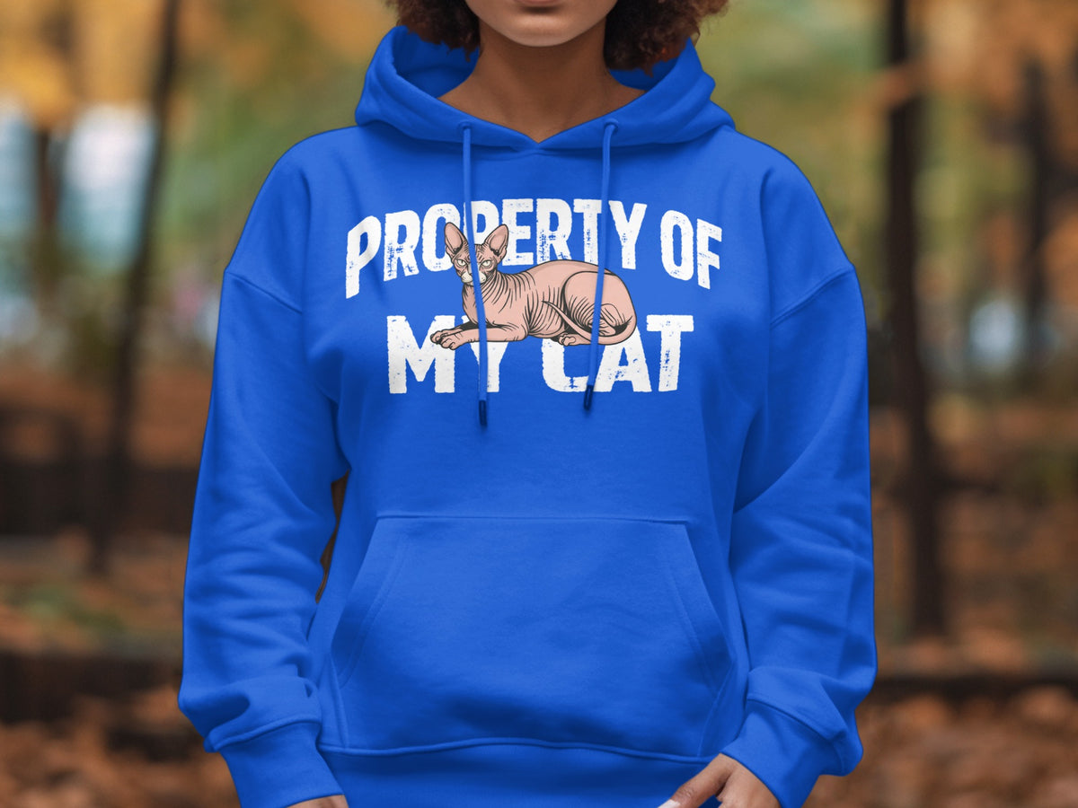 Blue hoodie with text "Property Of My Cat" and a sphinx cat illustration.