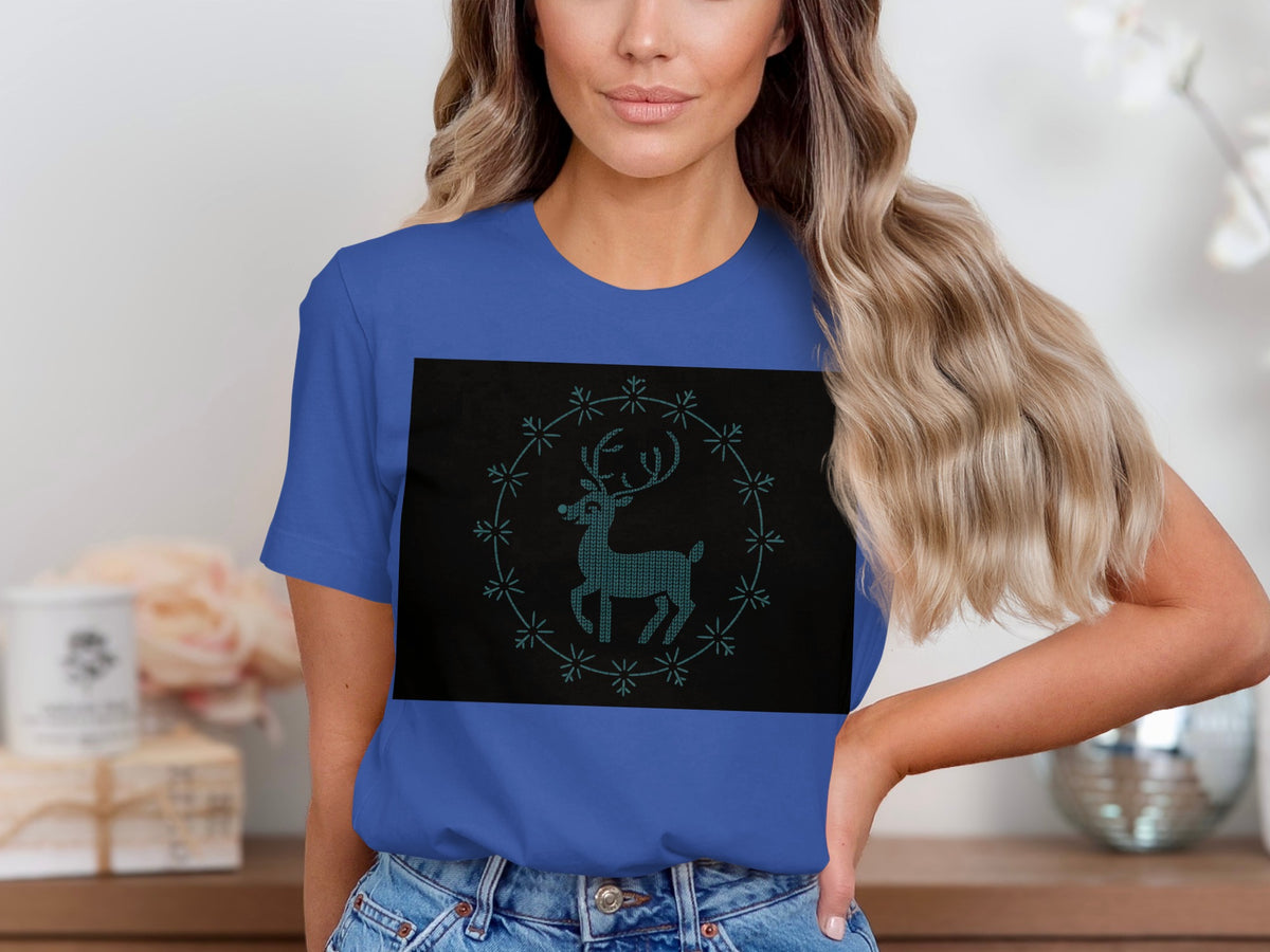 Blue t-shirt with a black rectangle featuring a teal deer in a snowflake circle.