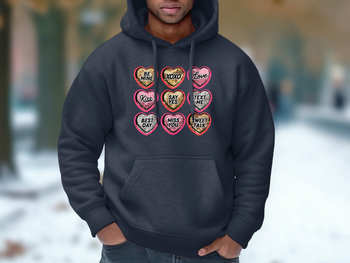 Dark grey hoodie with nine conversation hearts featuring Valentine's Day phrases.